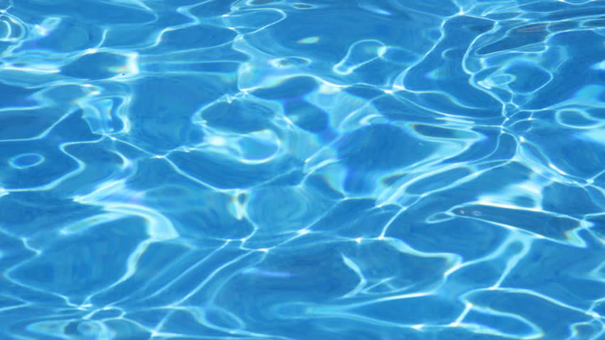 Beautiful sun reflection in the water of the swimming pool