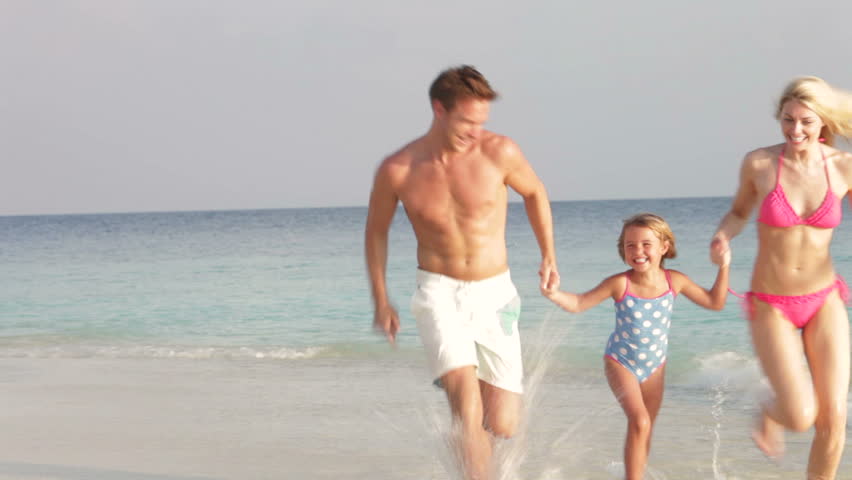 Family Having Fun On Beach Holiday
