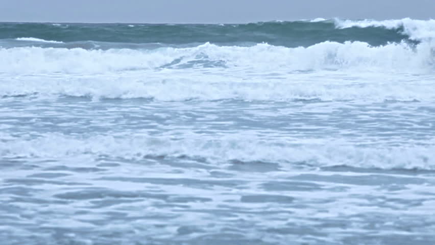 Waves roll to the beach in Maui, Hawaii.