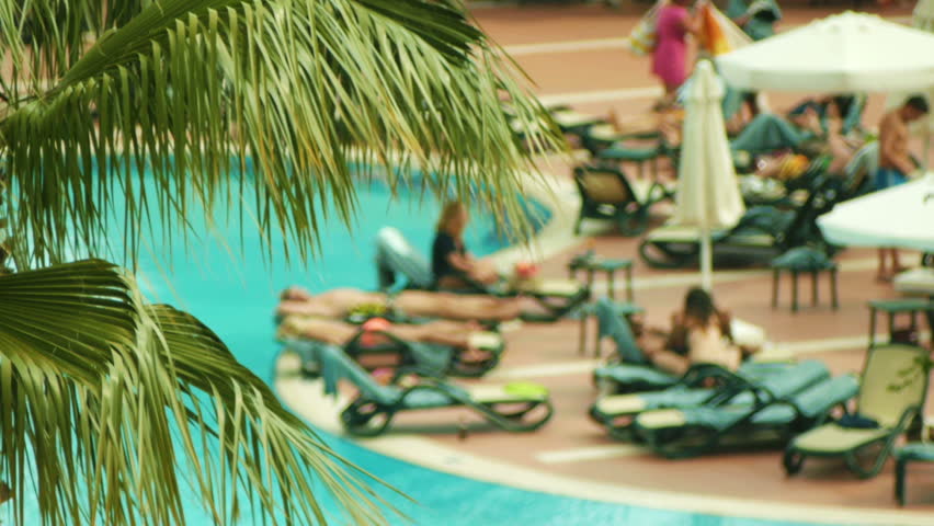 People relaxing near pull in hotel, DOF