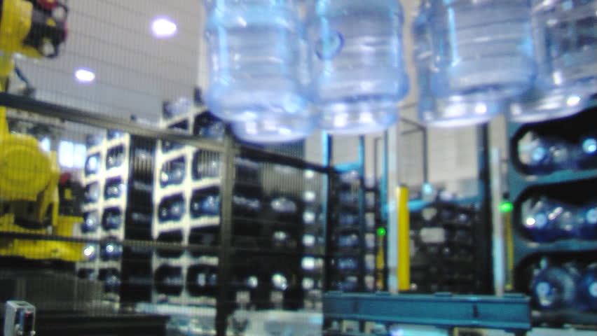 Servo-controlled robot in the bottled water factory.