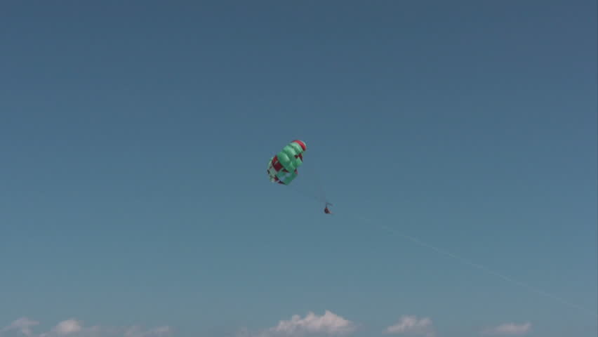 Parasailing over the Caribbean sea in Mexico