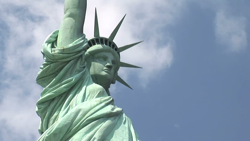 New York - MAY 16 2009: Tourists are starting to return to popular vacation spots like the Statue of Liberty after the world wide recession starts showing signs of recovery. 