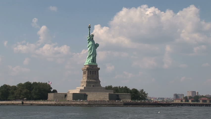 New York - MAY 16 2009: Tourists are starting to return to popular vacation spots like the Statue of Liberty after the world wide recession starts showing signs of recovery. 
