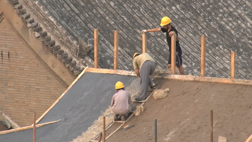 BEIJING - MAY 22 2009: Construction is starting to pick again after the world wide recession starts showing signs of recovery. 