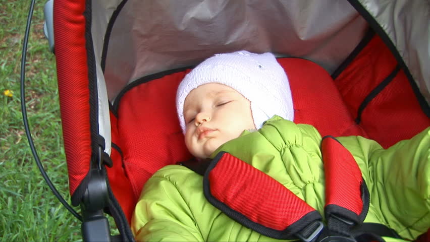 Little girl sleep in carriage