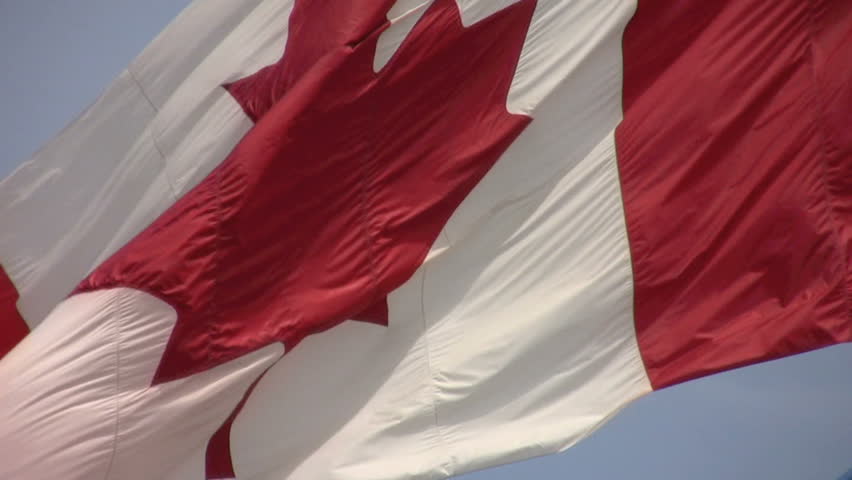 large real Canadian flag blowing in the wind