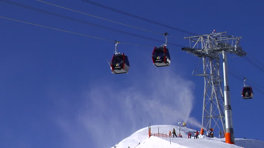 Cable-cars and snowmaking in a ski-resort in the European Alps