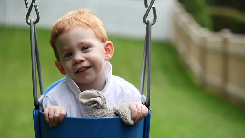 Cute baby boy on swing