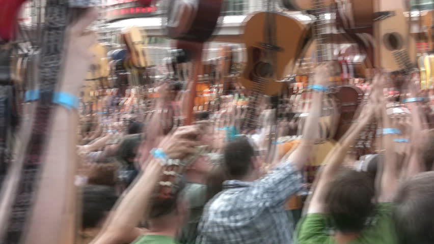 TORONTO - JULY 12: Guitarists attempt world record, July 12, 2009, Toronto,  Canada. Unfortunately, those gathered to play fell short of the world record of most people playing a single song. )