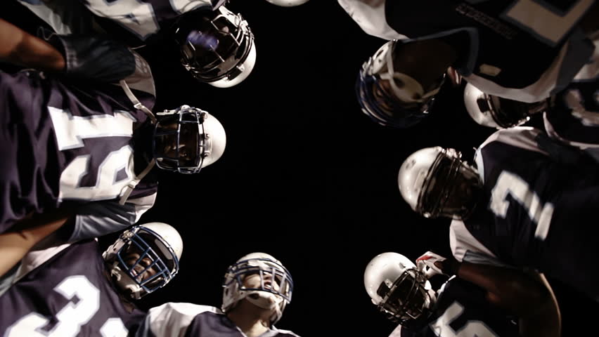 Low angle view looking up into the inside of a huddle