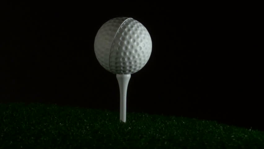 Golf ball on tee and grass V1
