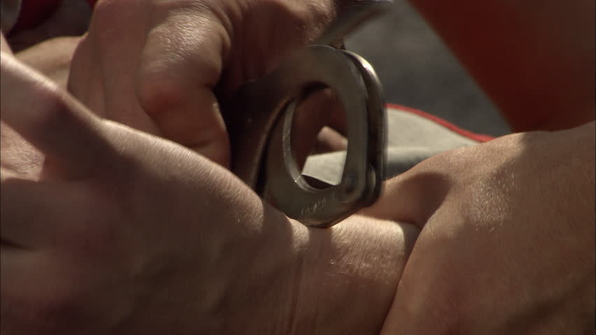 Criminal detention, close of an criminal's hands being handcuffed