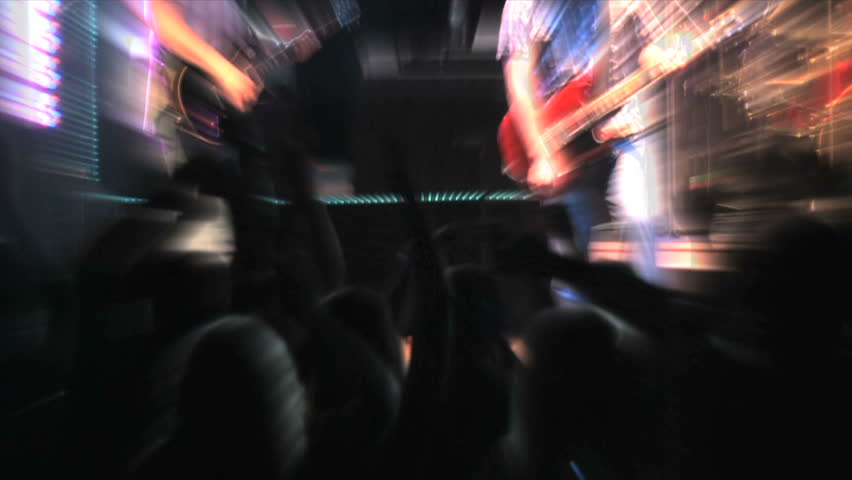 Fans applauding at a rock concert