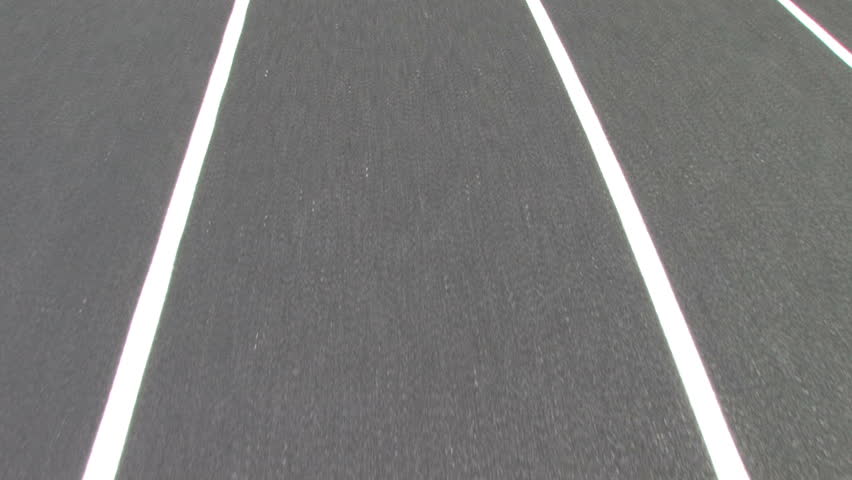 view of the race track while running. Shot with stabilizing Glidecam. 