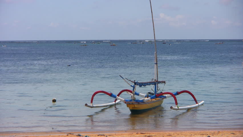 small fishing boat by the beach