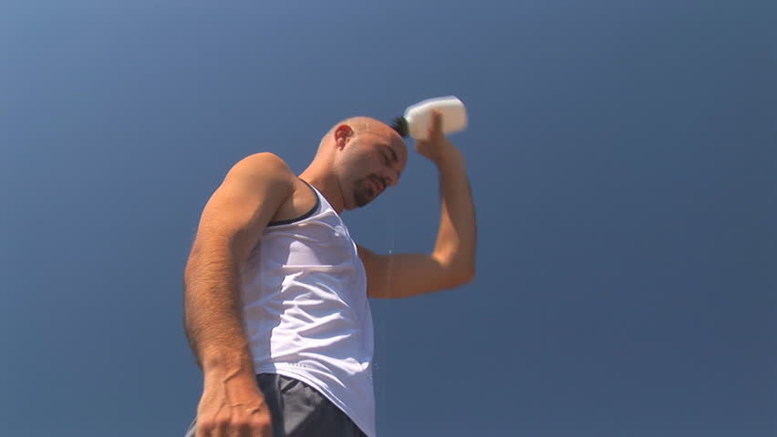 exhausted man taking some water