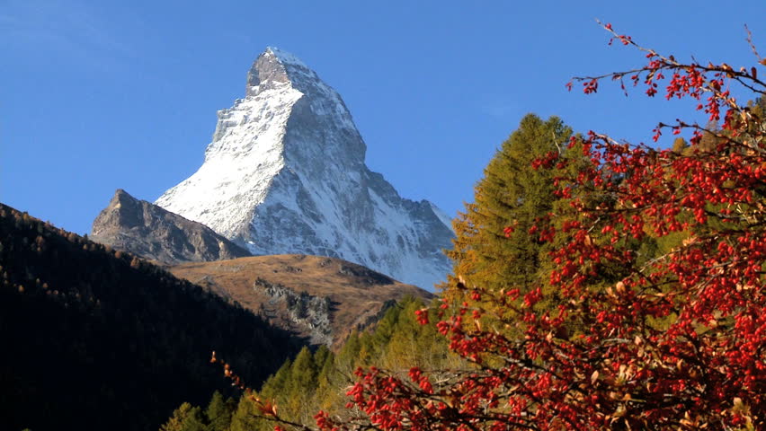 Fall in an alpine meadow, Zermatt, with hikers & the Matterhorn, motion jib