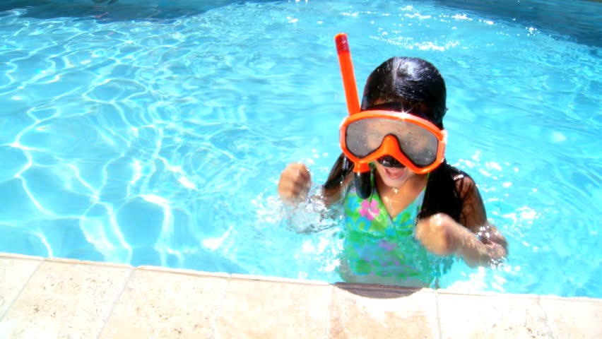 Young girl having fun  in her family swimming pool 60 FPS