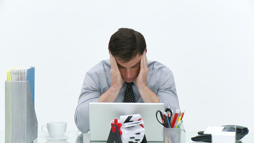 Frustrated businessman working in office