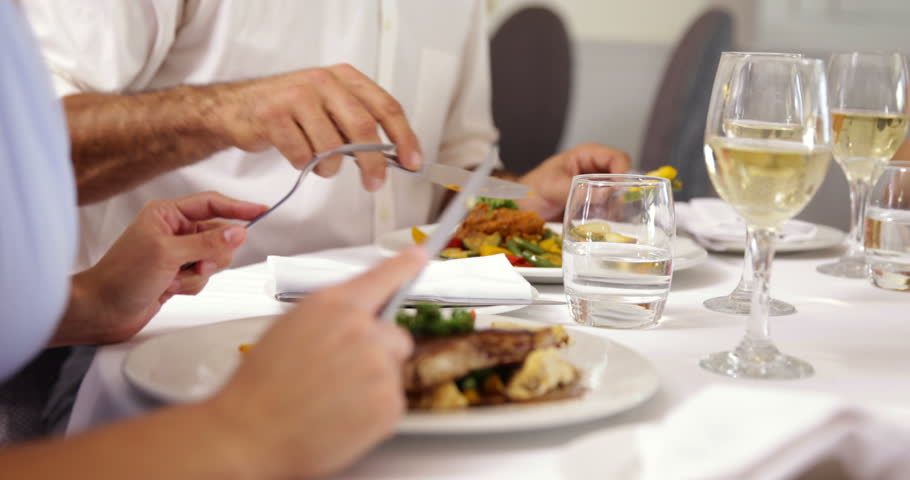 Group of friends eating dinner together at a restaurant