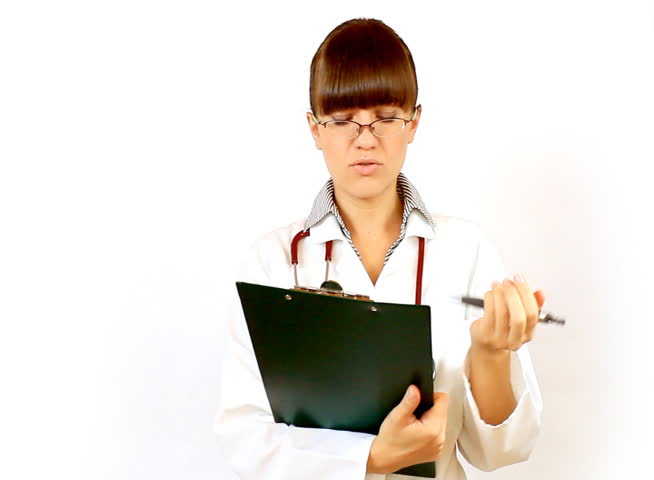 Female doctor recording something on notepad and prohibit