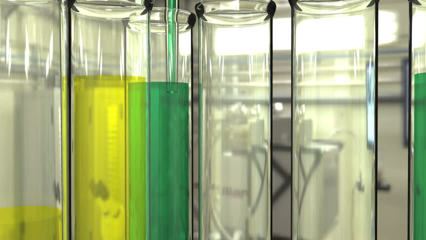 Close in video of pipette filling test tubes.