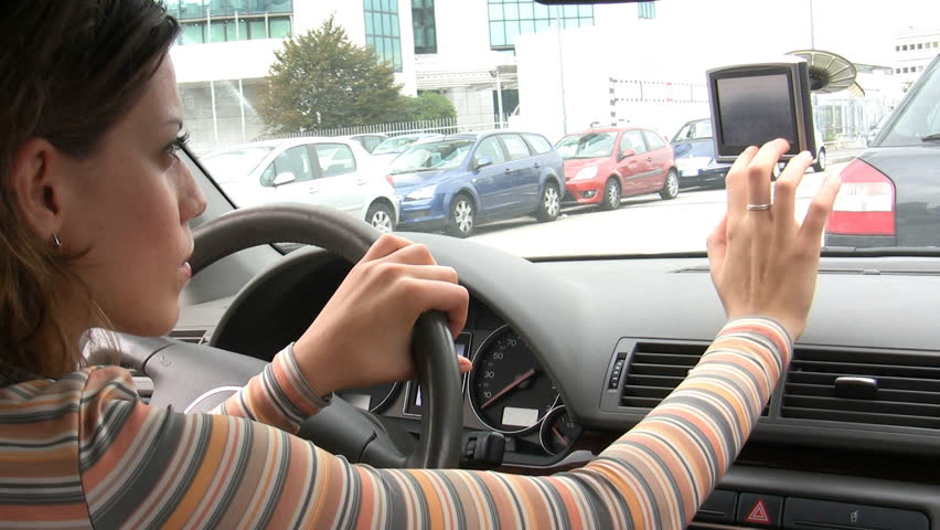 Rear view of young woman typing on global positioning system. HD 30 fps