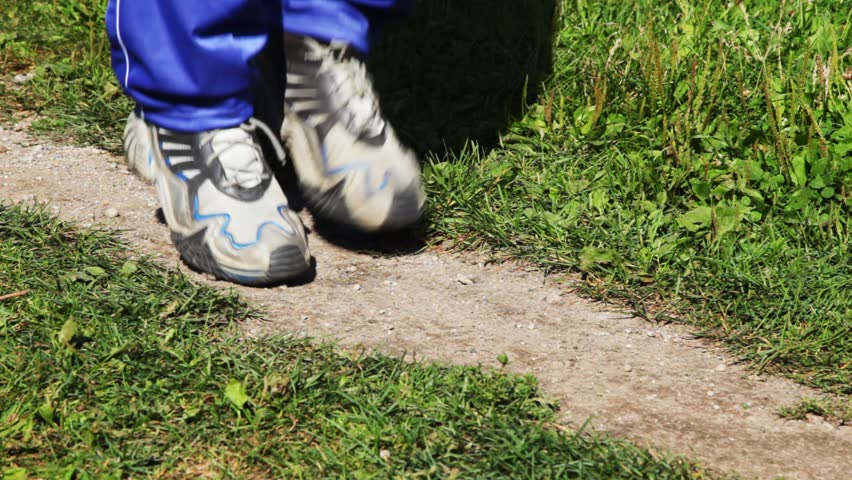 boots for run close-up running on place on lane in parks in summer 