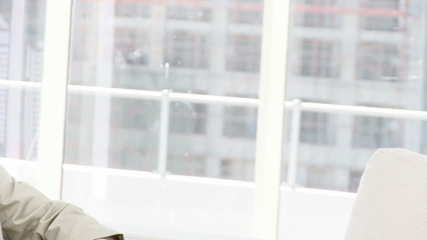 Charismatic Businessman on phone in the office