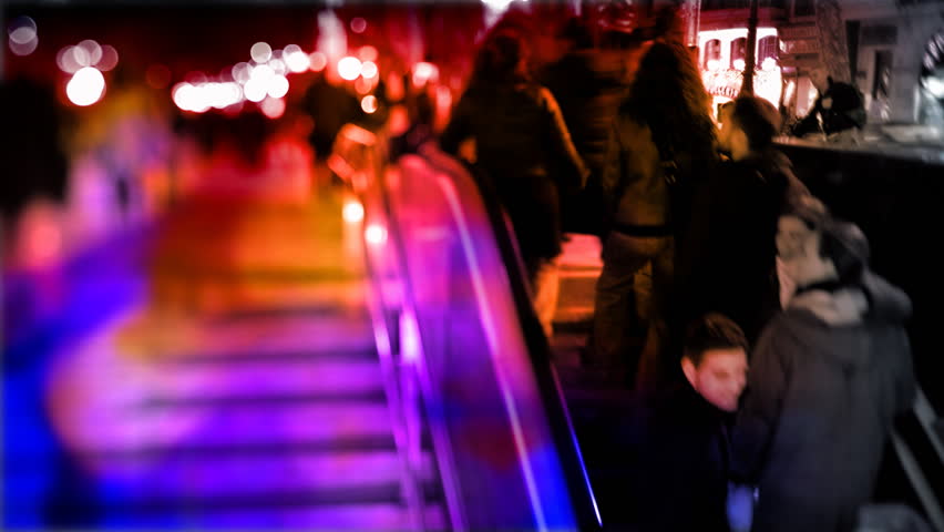 people going up and down a subway entrance in barcelona spain