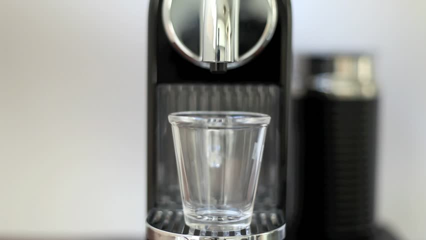 Espresso Glass of Coffee is poured and it settles like a heavy stout beer