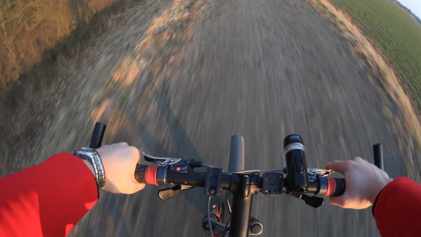 Riding a mountain bicycle on a country road 