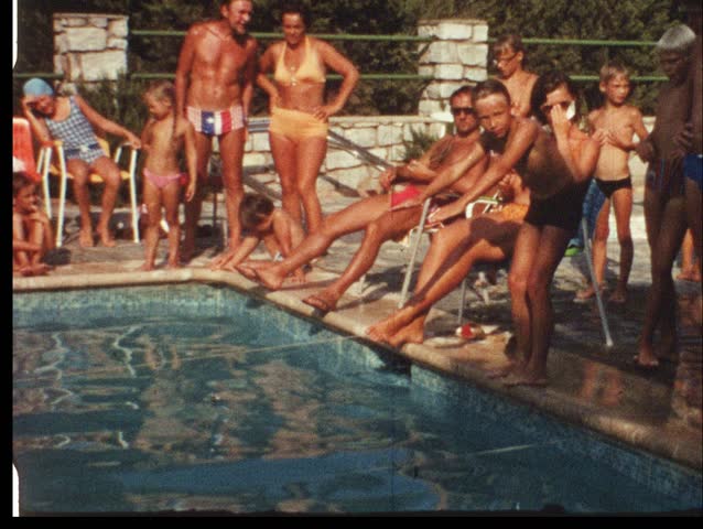 Boy jumping in swimming pool (vintage 8 mm amateur film)