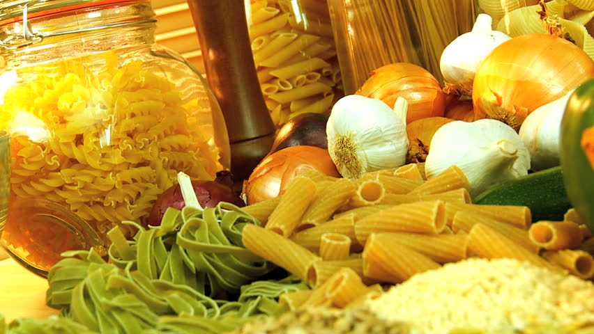 Traditional italian spaghetti bolognese ready to eat surrounded by healthy option vegetables, oils & pulses
