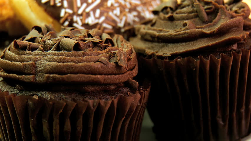 Unhealthy selection of indulgent high calorie sweet & sticky cakes & cookies