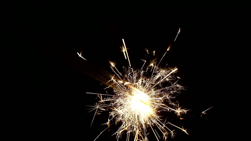 burning sparklers on black background