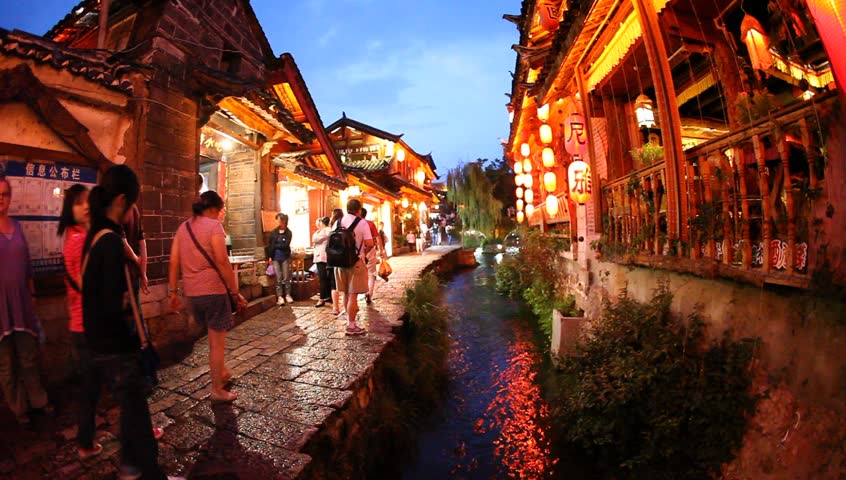 Lijiang, China - August 20: In the peak of the season, Chinese and world travelers enjoy  old town Lijiang including old architecture, restaurants and the local river in Yunnan, August 20, 2009