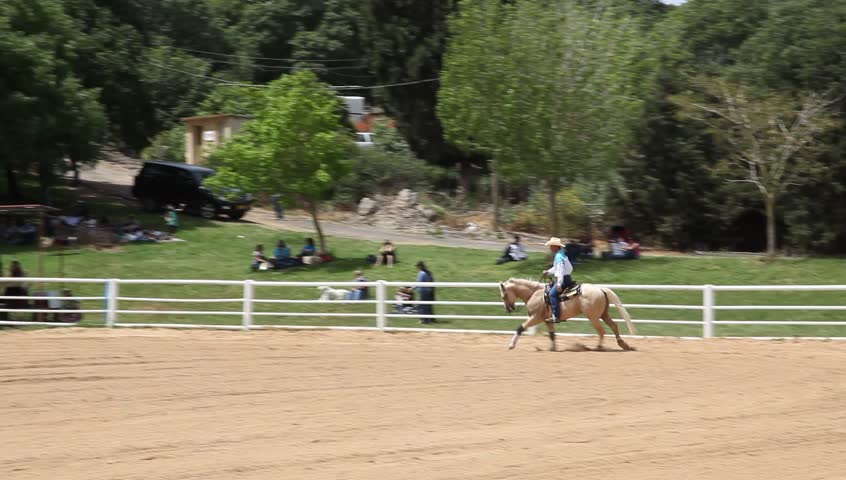 ALONIM, ISRAEL - APRIL 10: The semi annual horse riding, jumping, and trick competition is held at the top Western Riding School in Alonim in the Valley of Jezreel, April 10, 2010