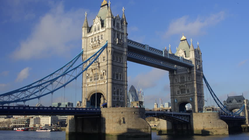 view of tower bridge with city in the background, london