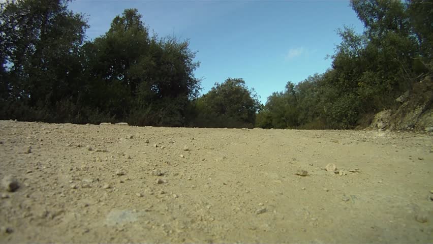 Man on mountain bike cycling fast along track