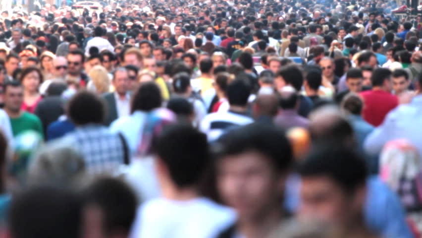 Street filled with a very busy anonymous crowd  