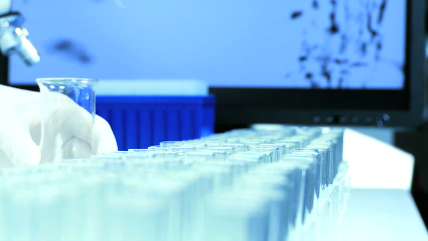 Test tubes & pipette being used for scientific research