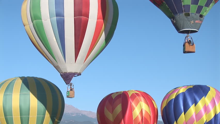 Two hot air balloon lift off