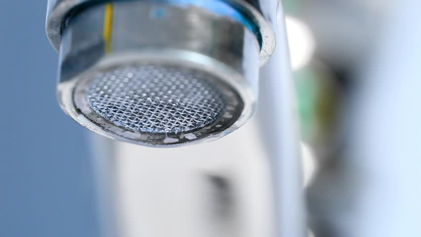 Extreme macro of water drops from home tap, polluted with thin fibers