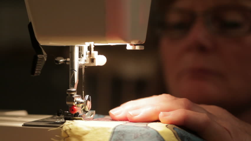Woman sewing on a sewing machine