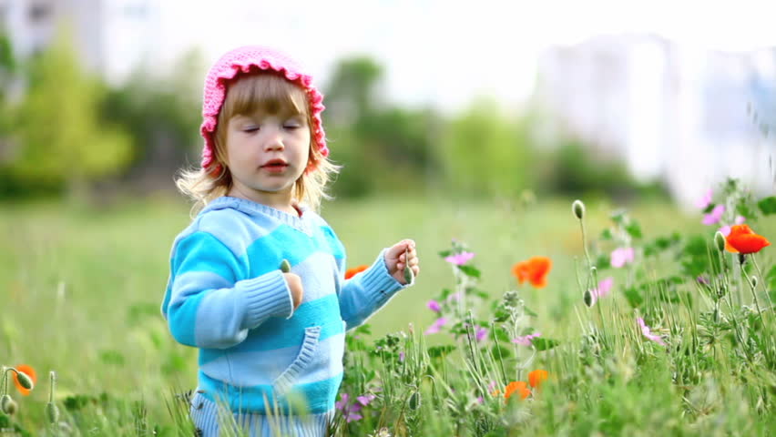 A child in a field of laughs, hiding in the grass-1_1