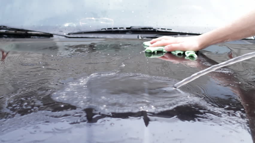 teenager washing the car 