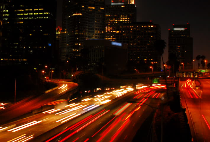 Highway through city at night time lapse