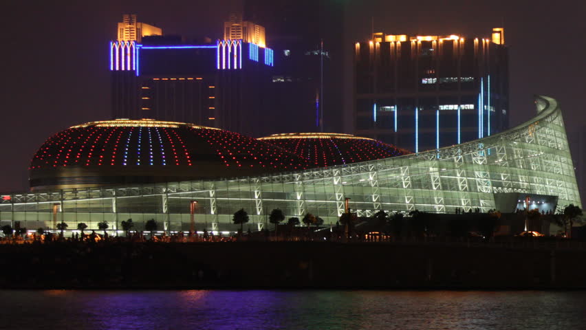 Illuminated Chinese Music Hall building, night. Time-lapse. 